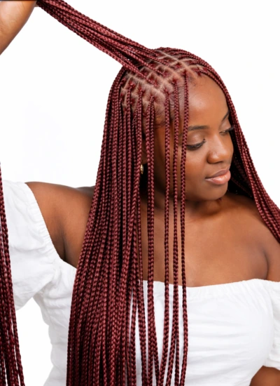 Knotless box braids styled at Jalia Walda African hair braiding salon in Houston, Texas