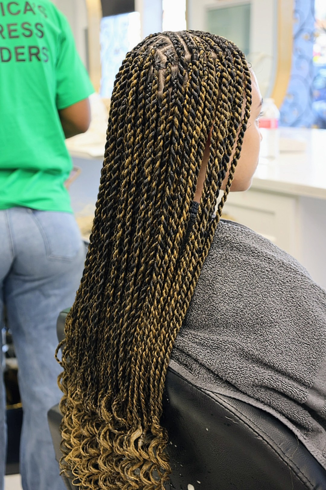 A close view of two-strand rope twists in black and honey, showing the smooth twisted rope texture