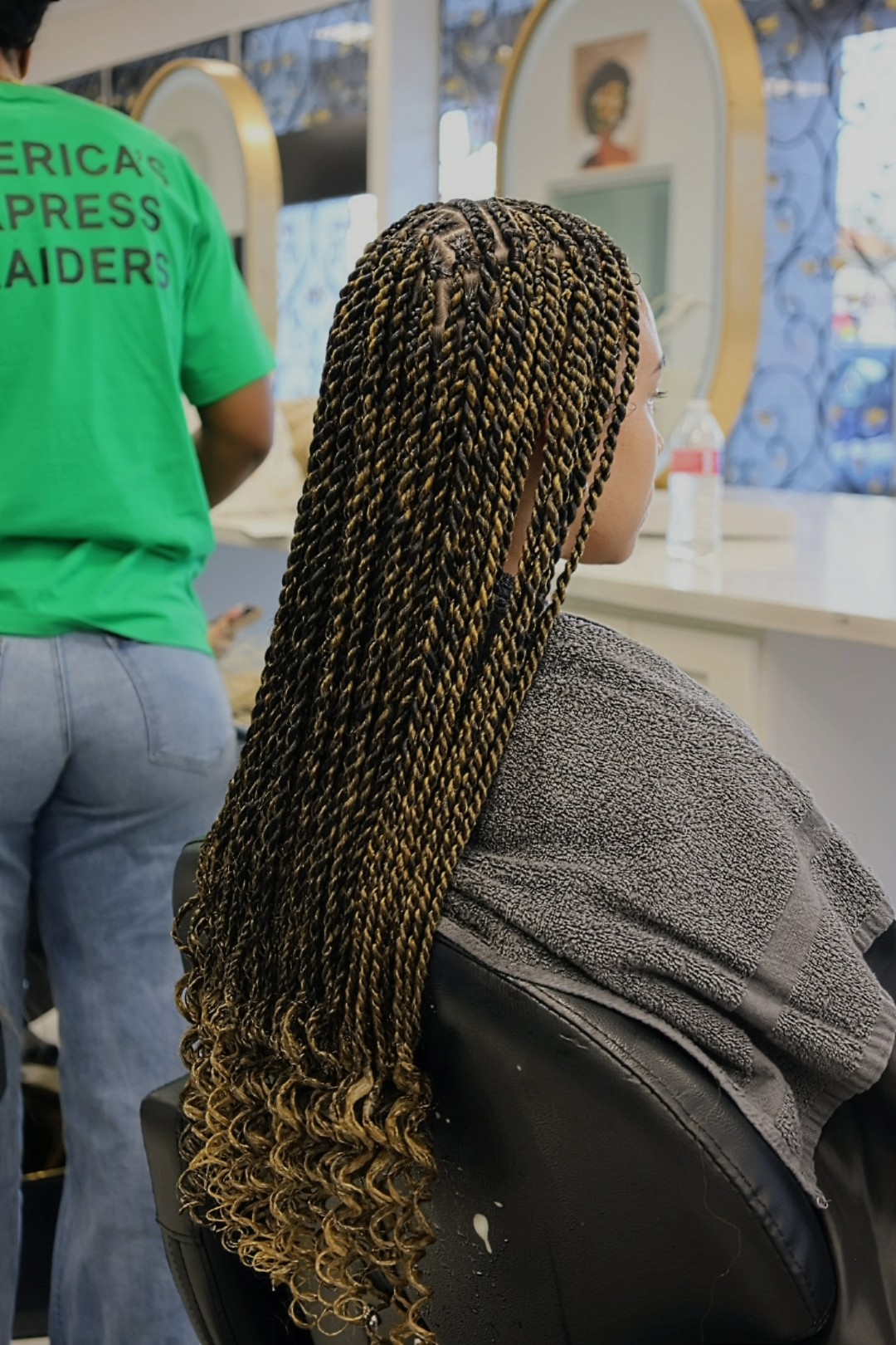 Honey-ombre rope twists from the side, the parting grid clear at the crown
