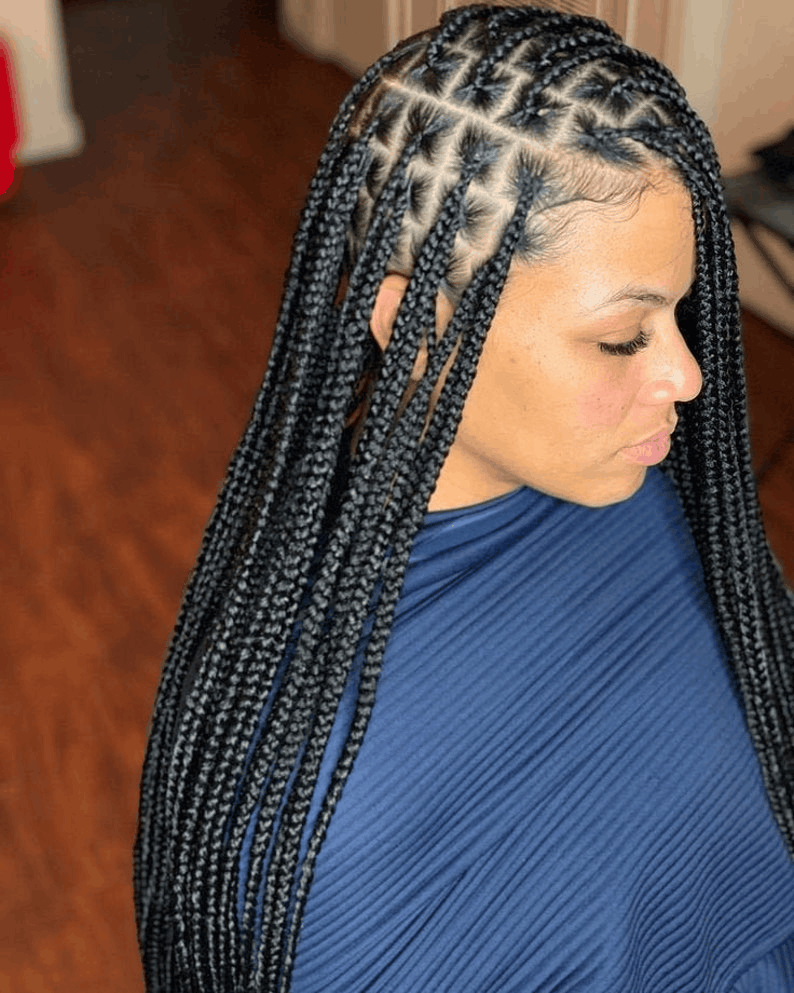 Waist-length knotless braids, side view, clean square parts across the crown, Jalia Walda Salon Houston