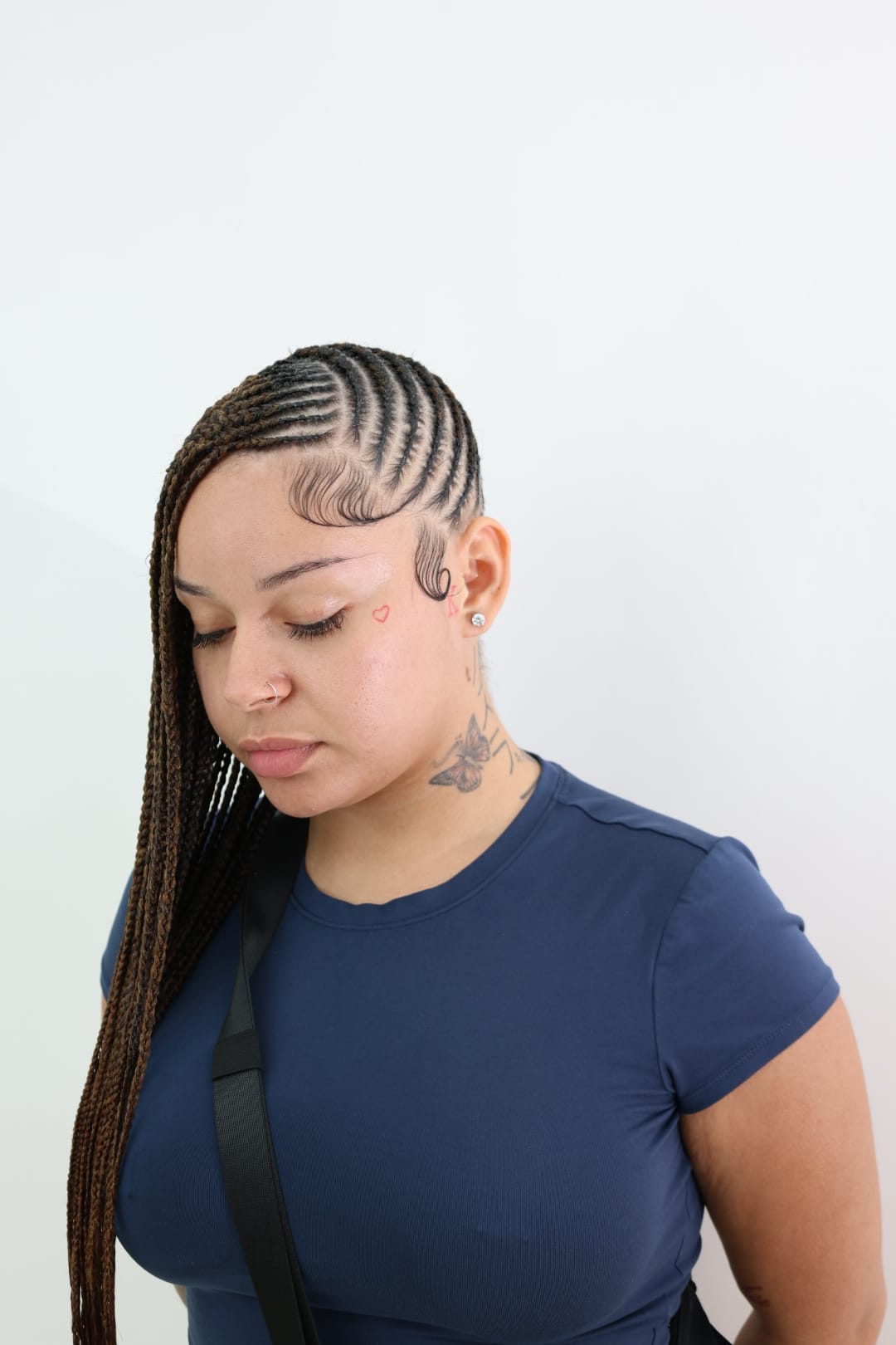 Lemonade braids from the front, the curved parting pattern across the crown and laid baby hair at the temple